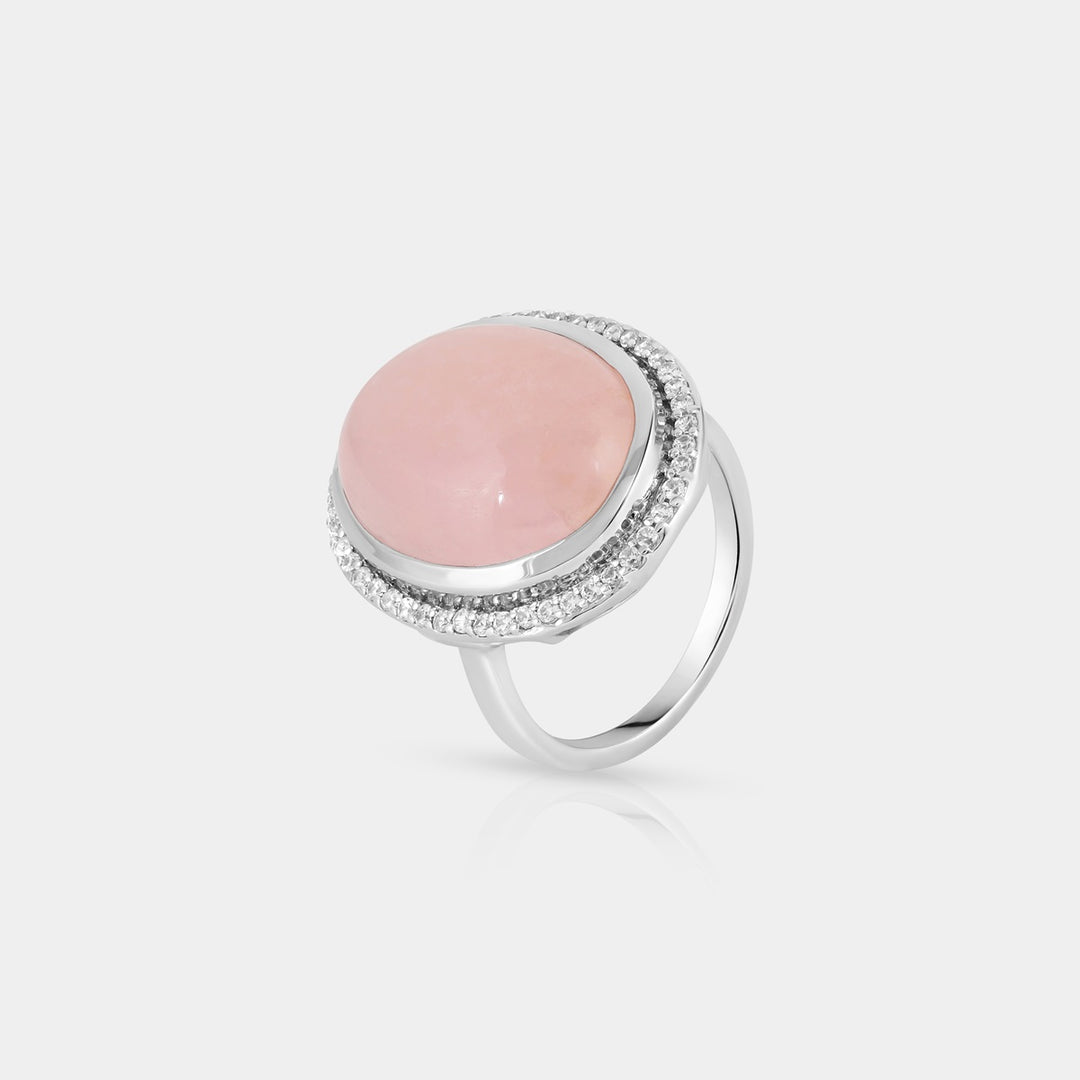 Side angle view highlighting the intricate details of the Cabochon with Accents Ring. The 48 prong-set Zircon accents sparkle alongside the smooth contours of the pink Morganite.